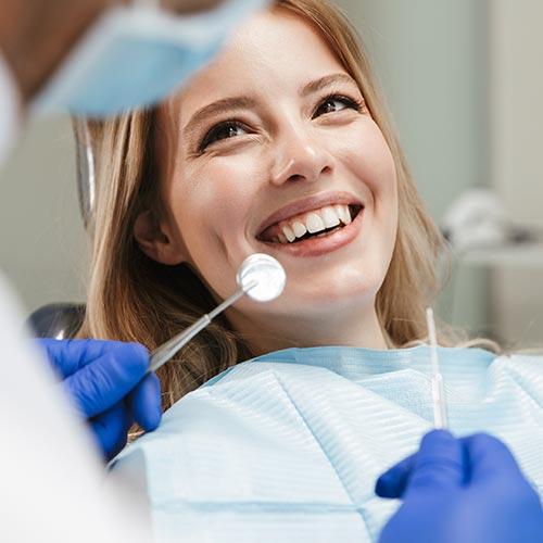 woman at dental hygiene appointment doing a dental exam in Mississauga