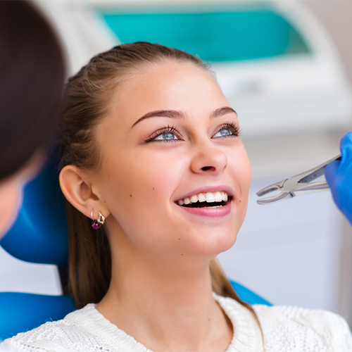 General dentist in Mississauga performing tooth extractions